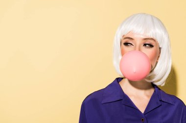 Girl in white wig chewing bubble gum on yellow background clipart