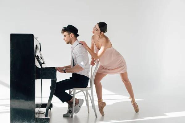 Handsome Pianist Playing Piano While Young Ballerina Touching His Shoulder — Stock Photo, Image