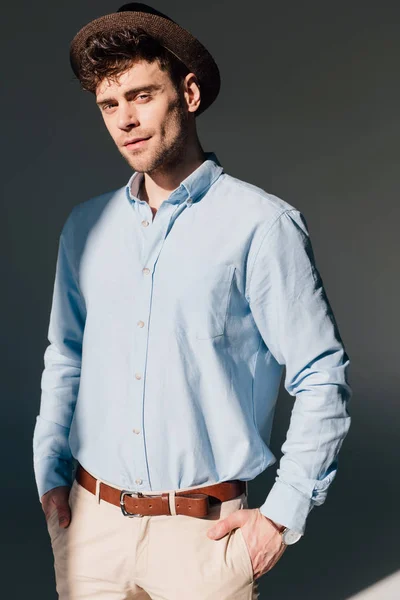 Handsome Man Blue Shirt Brown Hat Standing Sunlight — Stock Photo, Image