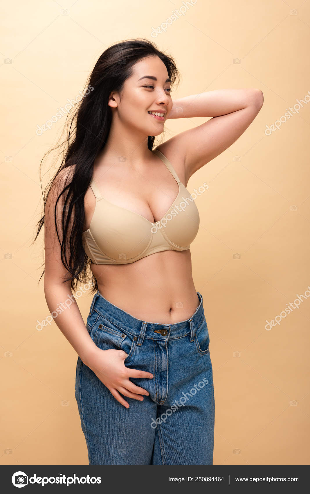 Happy Girl Blue Jeans Bra Holding Hand Head Looking Away Stock Photo by  ©AllaSerebrina 250894464