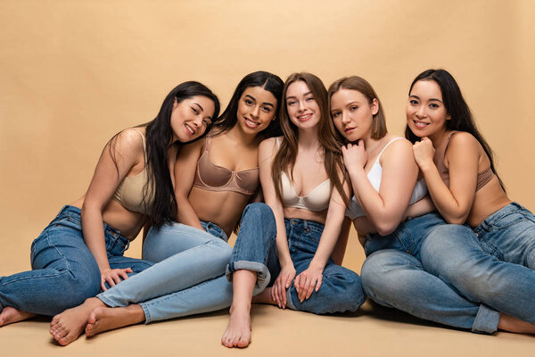five smiling beautiful multicultural women posing at camera, body positivity concept