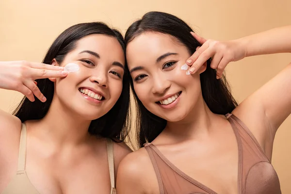 Two Happy Multicultural Women Applying Cosmetic Cream Face Looking Camera — Stock Photo, Image