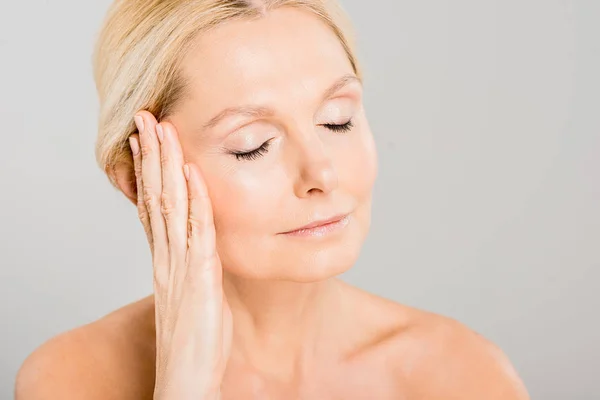 Attractive Blonde Mature Woman Closed Eyes Touching Her Face Isolated — Stock Photo, Image