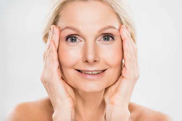 Beautiful Smiling Mature Woman Looking Camera Touching Her Face Grey — Stock Photo, Image