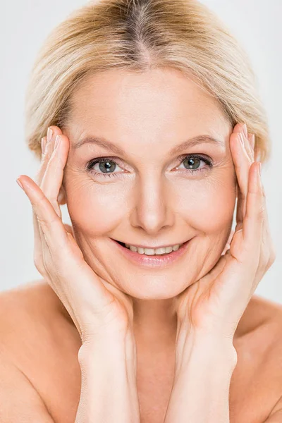 Beautiful Smiling Mature Woman Looking Camera Touching Her Face Isolated — Stock Photo, Image