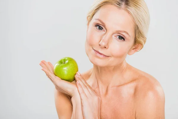 Beautiful Mature Woman Holding Green Ripe Apple Looking Away Grey — Stock Photo, Image