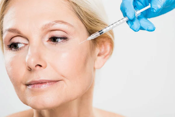 Beautiful Mature Woman Getting Beauty Injection Looking Away Isolated Grey — Stock Photo, Image