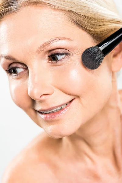 Beautiful Mature Woman Applying Blush Cosmetic Brush Looking Camera Isolated — Stock Photo, Image