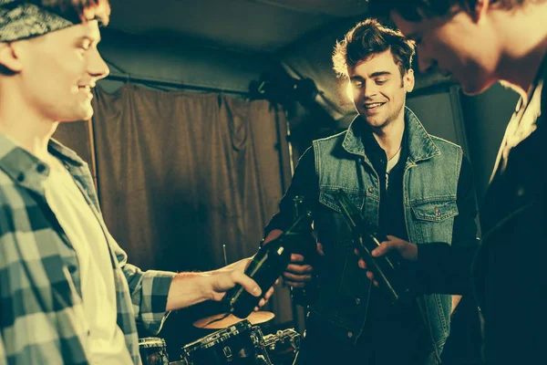 Selective Focus Cheerful Man Clinking Bottle Friends — Stock Photo, Image