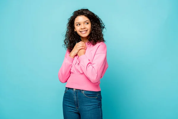 Happy Curly African American Woman Standing Clenched Hands Isolated Blue — Stock Photo, Image