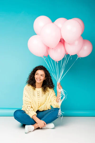 Cheerful Curly African American Girl Sitting Pink Air Balloons Blue — Stock Photo, Image