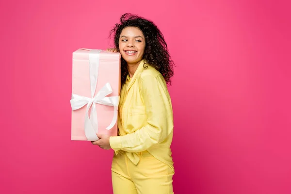 Cheerful Curly African American Woman Holding Pink Gift Box White — Stock Photo, Image