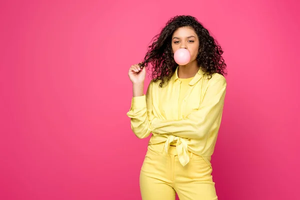 Attractive Curly African American Woman Blowing Bubble Gum Touching Hair — Stock Photo, Image