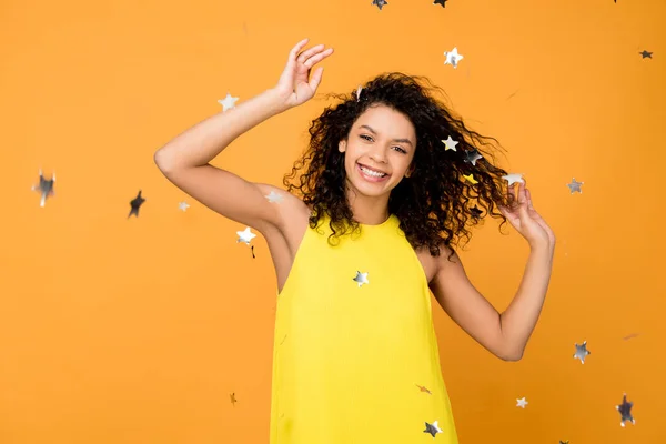 Happy Curly African American Woman Smiling Shiny Confetti Stars Orange — Stock Photo, Image