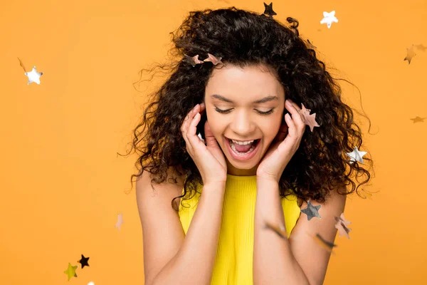 Happy Curly African American Girl Screaming Shiny Confetti Stars Orange — Stock Photo, Image