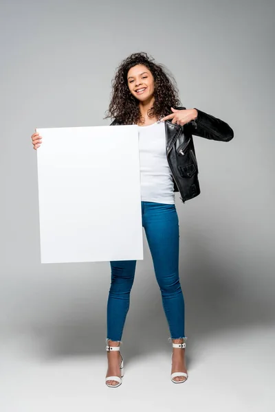 Beautiful Curly African American Girl Pointing Finger Blank Placard While — Stock Photo, Image