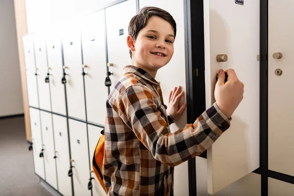 Smiling Schoolboy Checkered Shirt Backpack Opening Locker — Stock Photo, Image