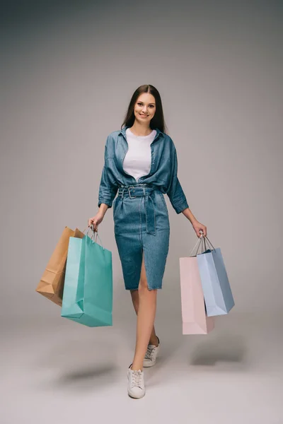 Smiling Beautiful Woman Denim Dress Holding Shopping Bags Looking Camera — Stock Photo, Image
