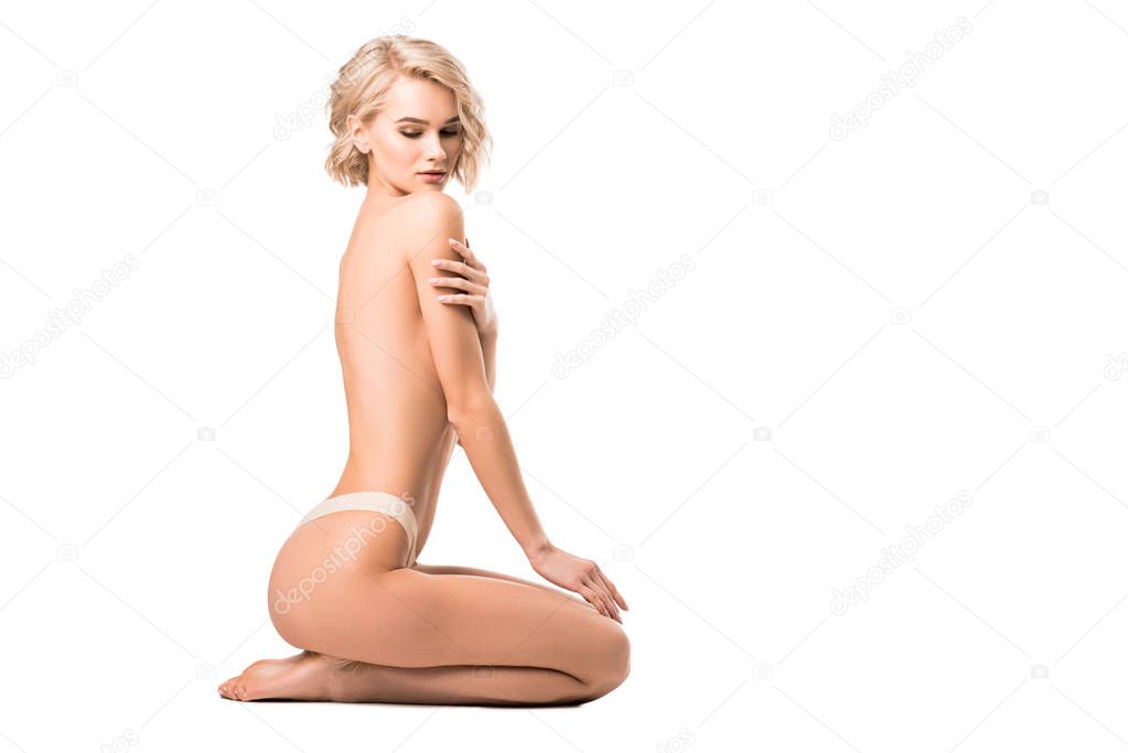 beautiful half-naked girl covering breasts isolated on white with copy space