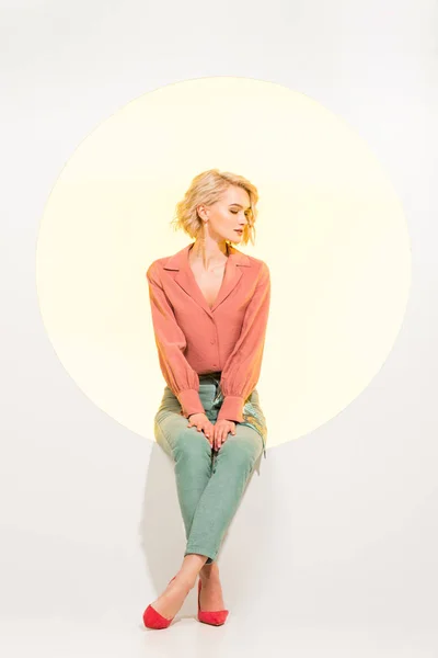 Beautiful Fashionable Girl Posing While Sitting Yellow Circle White Background — Stock Photo, Image