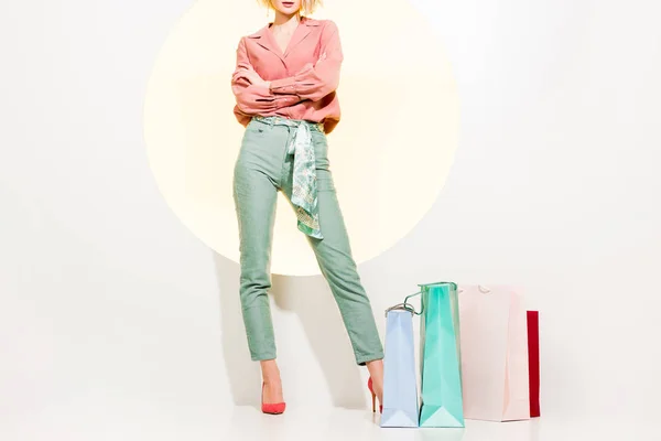 Cropped View Stylish Girl Arms Crossed Posing Shopping Bags White — Stock Photo, Image