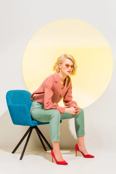 Beautiful Fashionable Girl Colorful Clothes Sitting Armchair White Yellow Circle — Stock Photo, Image