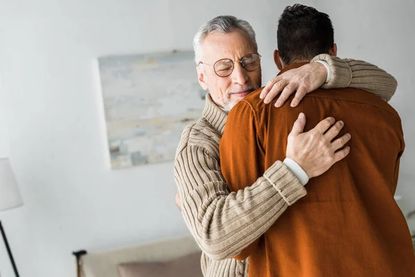 Senior Man Glasses Smiling While Hugging Son — Stock Photo, Image