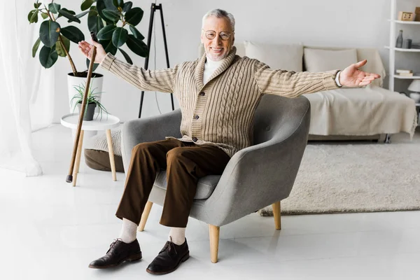 Happy Retired Man Glasses Sitting Armchair Outstretched Hands — Stock Photo, Image