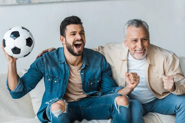 Senior Man Watching Championship Cheering Handsome Son Holding Football — Stock Photo, Image