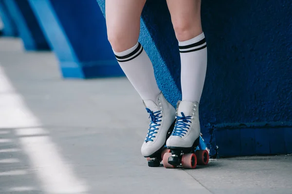 Partial view of woman in white high socks and retro roller skates — Stock Photo