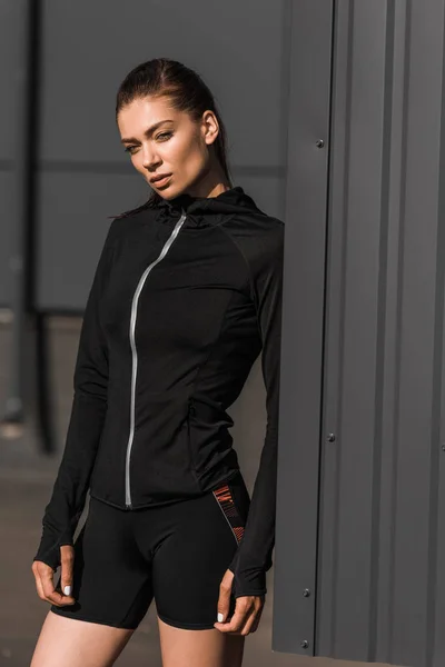 Beautiful young sportswoman posing in thermal clothes — Stock Photo