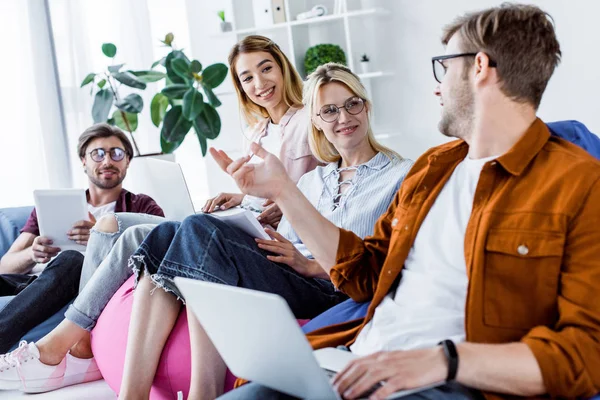 Multicultural colleagues discussing startup project in office — Stock Photo