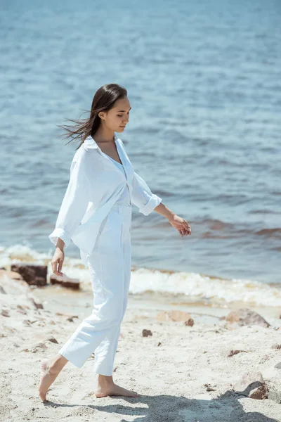 High angle view of beautiful asian woman standing on beach by sea — Stock Photo