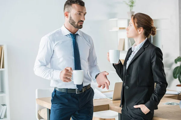 Accountants talking in office during coffee break — Stock Photo