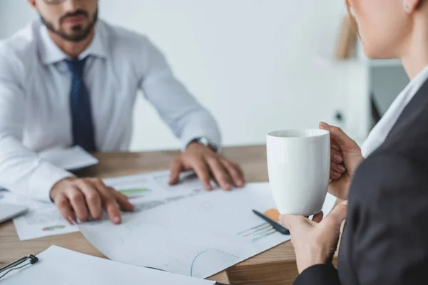 Cropped image of business advisers working at table in office — Stock Photo