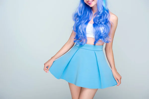 Cropped shot of young woman with bright blue hair isolated on grey — Stock Photo