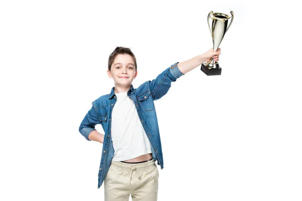 Schoolboy showing winner cup isolated on white — Stock Photo