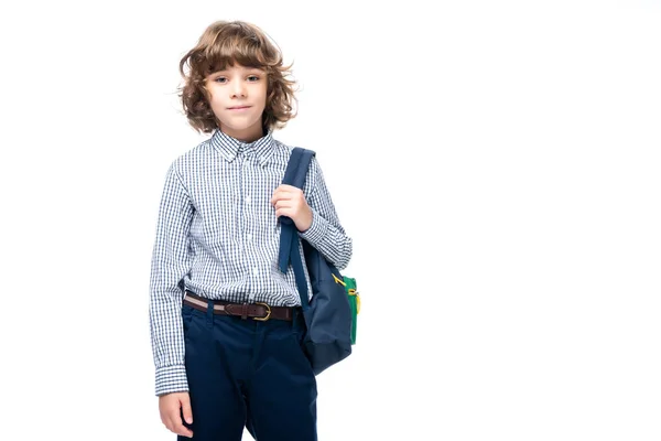 Schoolboy holding backpack and looking at camera isolated on white — Stock Photo