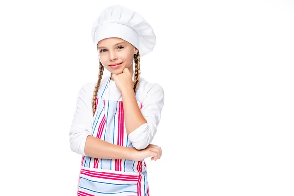 Scuola pensierosa in costume di chef toccando mento isolato su bianco — Foto stock