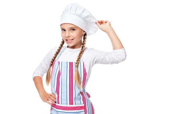 Schoolchild posing in apron and chef hat isolated on white — Stock Photo