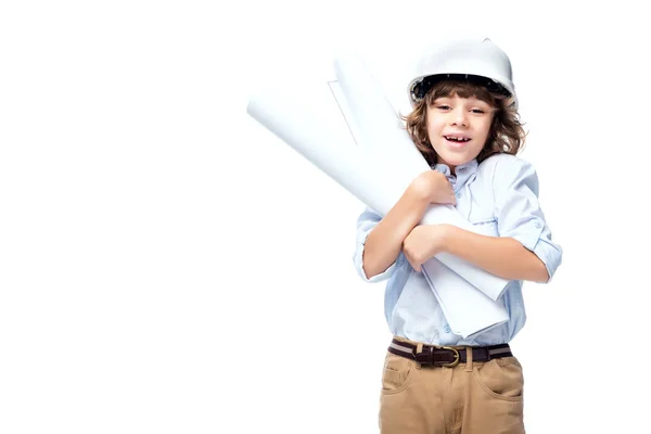 Schoolboy in costume of architect and helmet hugging blueprints isolated on white — Stock Photo