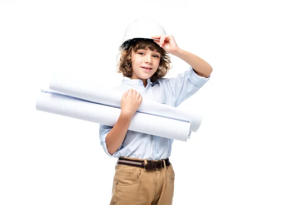 Школярка в костюмі архітектора і шолома тримає креслення ізольовані на білому — стокове фото