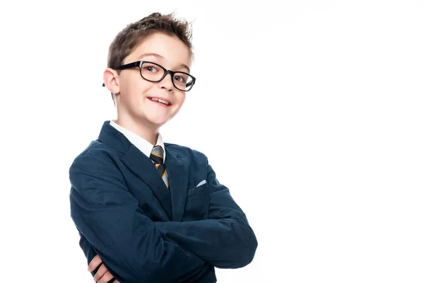 Smiling schoolboy in businessman suit looking at camera isolated on white — Stock Photo