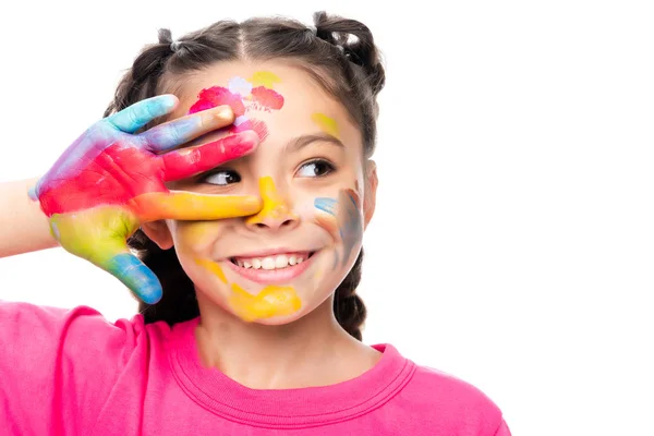 Retrato de niño sonriente con la cara pintada y la mano mirando hacia otro lado aislado en blanco - foto de stock
