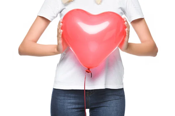 Cropped image of girl in white shirt holding heart shaped balloon isolated on white — Stock Photo