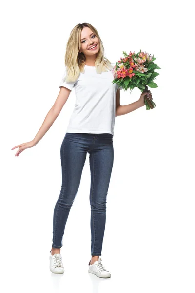 Attractive girl posing with bouquet of flowers in white shirt isolated on white — Stock Photo