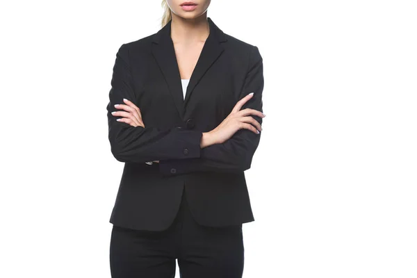 Cropped shot of young businesswoman with crossed arms isolated on white — Stock Photo