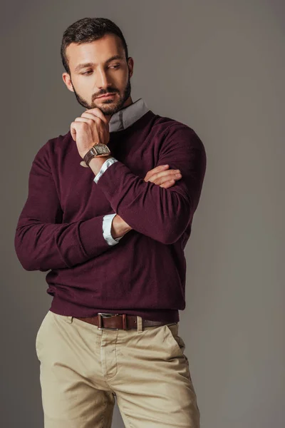 Handsome bearded man posing in burgundy sweater, isolated on grey — Stock Photo