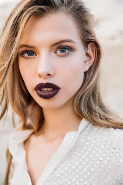 Portrait of attractive blonde woman with dark lipstick — Stock Photo