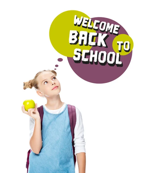 Schoolchild holding apple and looking up at speech bubble with 